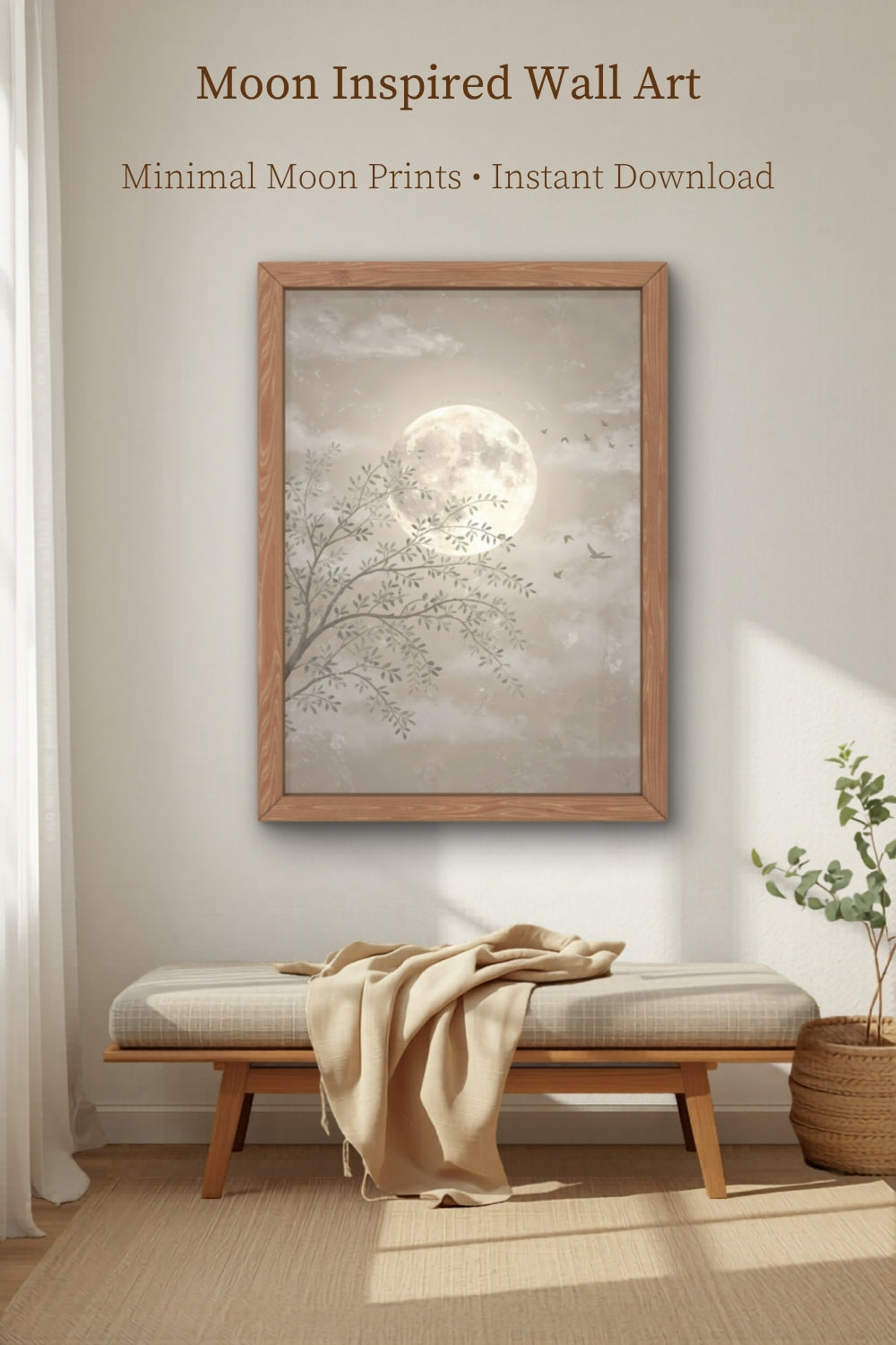 Minimal moon wall art print displayed above wooden bench in cozy neutral room with warm natural light